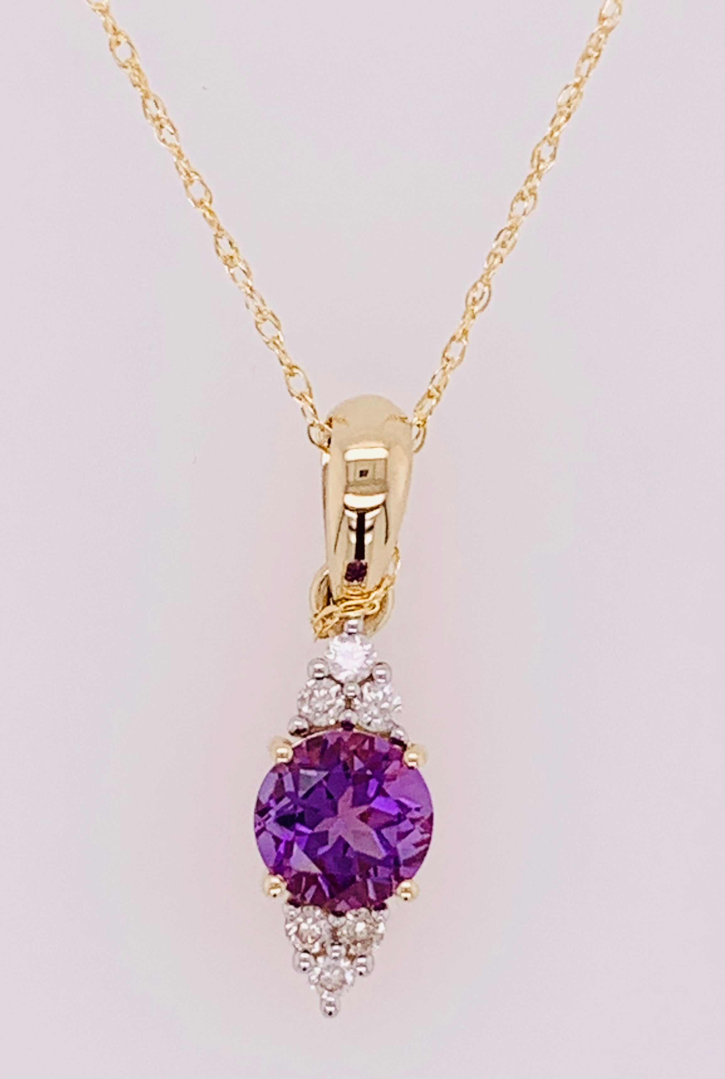 14K Amethyst and Diamond Pendant.